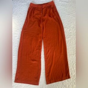 Elegant terracotta-colored Naked Zebra wide-leg trousers, size s
